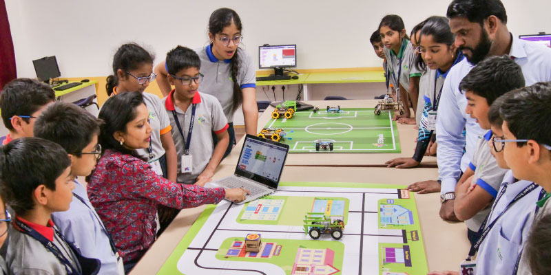 image where teacher guiding students